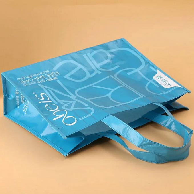 折り畳み式の青の非編まれたギフト袋、薄板にされた非編まれた再使用可能な袋