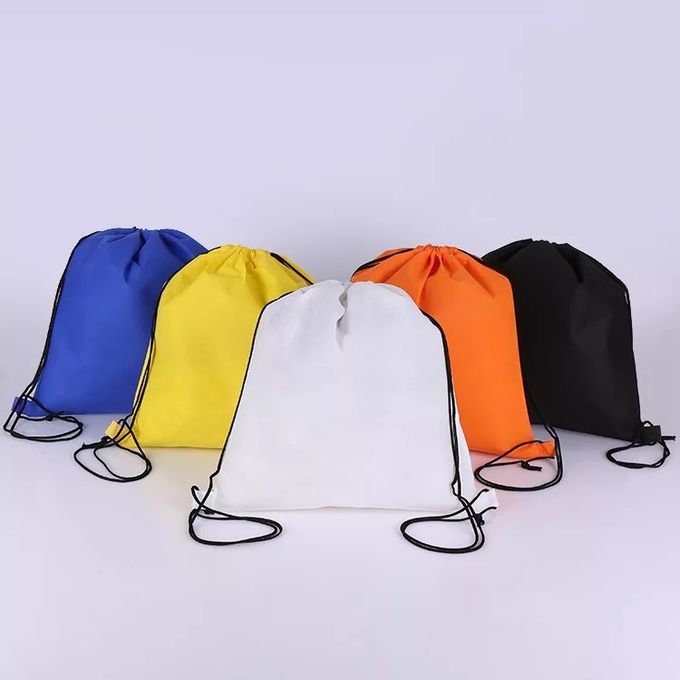 エコの運動選手のパッキングおよび付属品のための友好的なオレンジ スポーツのドローストリングのバックパック